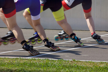 Fototapeta premium Inline Speedskating Moments Race Start and Race Track Action Starting Line and Finish Line Roller Skate Race Championship Competition Race 