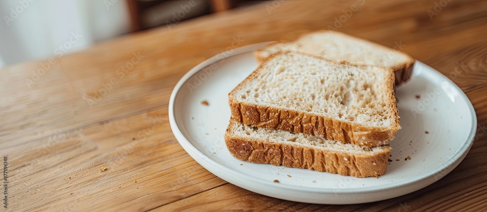 Poster a slice of bread displayed on a white plate, with copy space image.