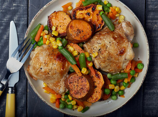 Grilled chicken with vegetables and grilled sweet potato.