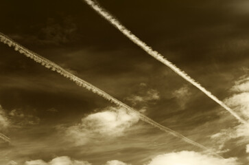 Sepia sky with contrails