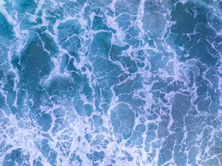 Aerial top view nature background of waves crashing in the ocean sea water, Drone view of sea waves in bird eye waves photo,Waves background