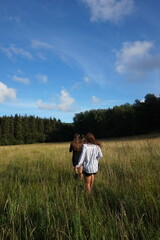friends in field, summertime