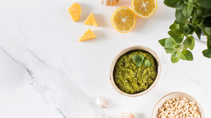 Fresh homemade pesto sauce in a bowl. Italian cuisine. Recipe. Copy space