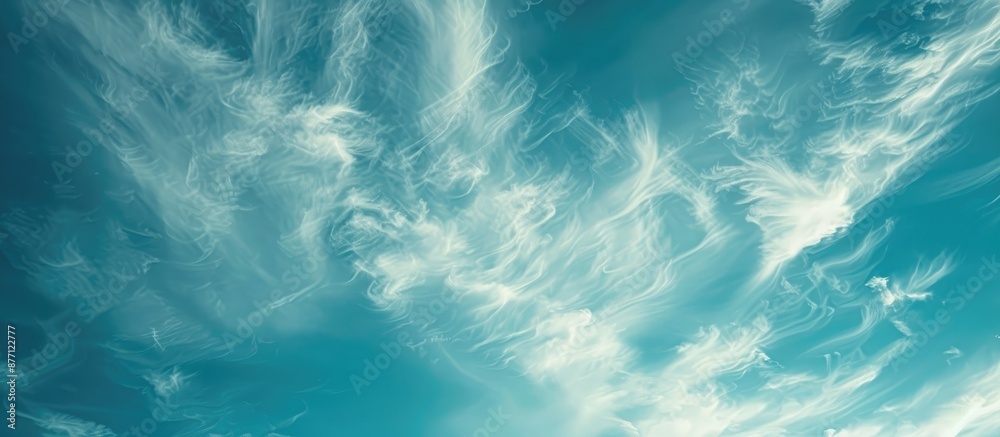 Poster A serene cloudscape with white wispy clouds against a blue sky, ideal as a background image for design projects with copy space. Conveys a sense of hope and peace, evoking a celestial theme.