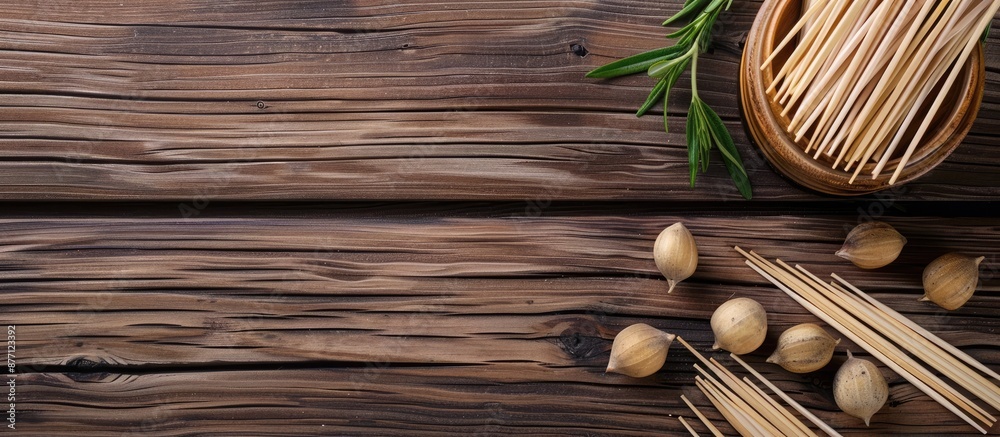 Aufkleber wooden background with disposable toothpicks and holder arranged in a flat lay composition, featurin