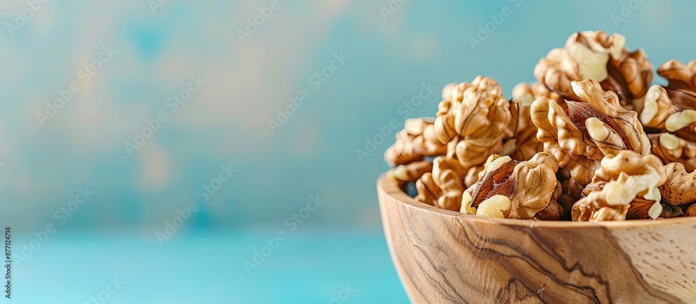 Aufkleber close-up of walnut kernel halves in a wooden bowl on a colored background, emphasizing healthy eatin