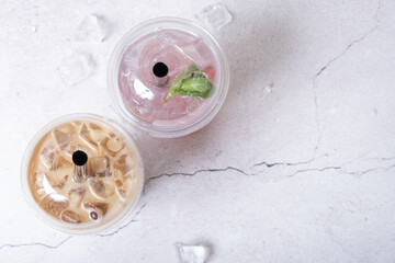 Two plastic glasses with ice bubble tea. Trendy summer drink with tapioca bubbles