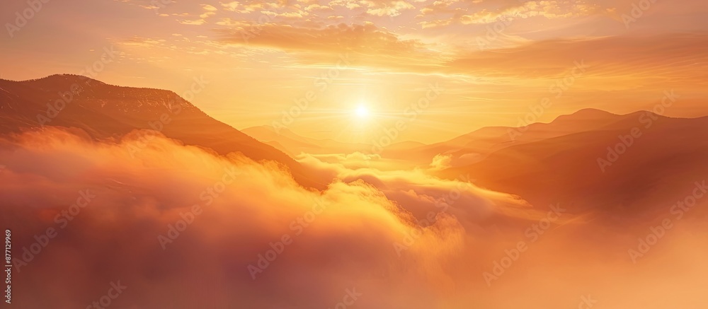 Poster a stunning sunrise in the mountains with a large fog floating over the high mountain scenery, creati