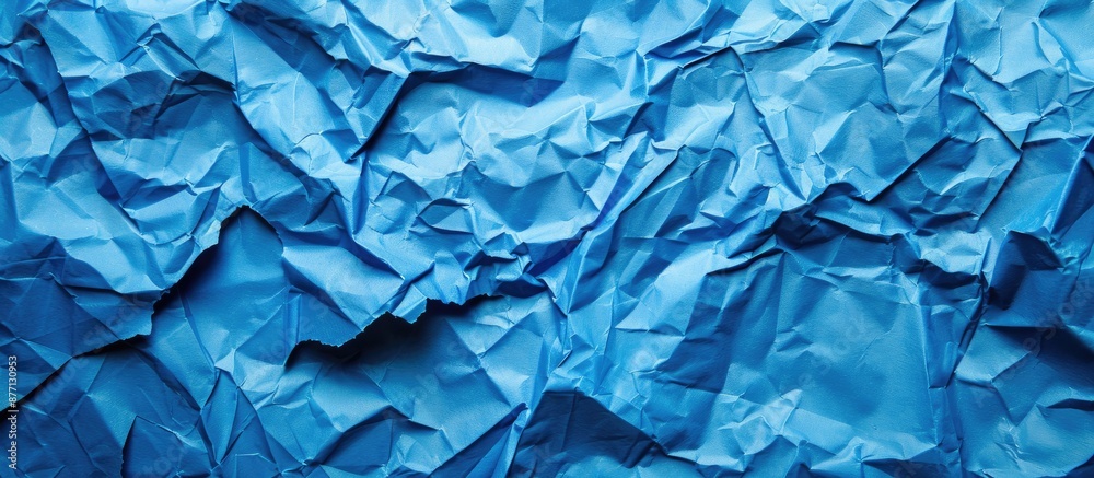 Aufkleber background featuring crumpled blue paper with copy space image.