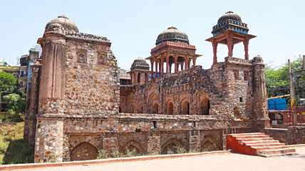 Fototapeta premium Ruined view of Jahaz Mahal, 15th-century Lodi era architecture, Mehrauli, Delhi, India.