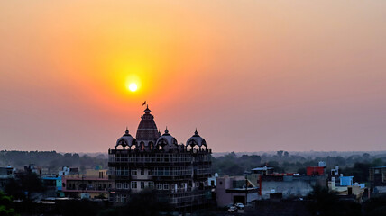Obraz premium Beautiful sunset view with temple, Vrindavan, Mathura, Uttar Pradesh, India.