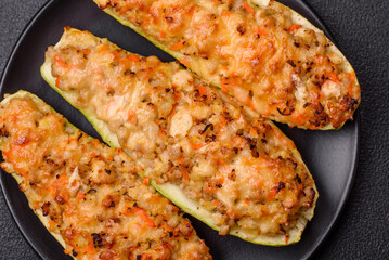 Zucchini halves baked with cheese, tomatoes, meat or meat substitute