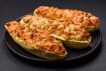 Zucchini halves baked with cheese, tomatoes, meat or meat substitute