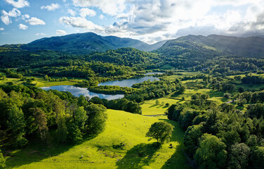 Lake District National Park landscape. S.W. over Elterwater from above Neaum Crag, Langdale, to...
