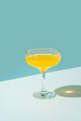 Cocktail spritz with passion fruit on blue background