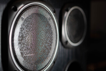 Close-up of speaker drivers with metal grilles