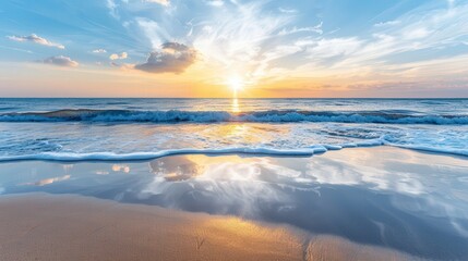 Fototapeta premium Stunning sunset over a calm ocean with waves gently hitting the sandy shore, creating a serene and reflective landscape.