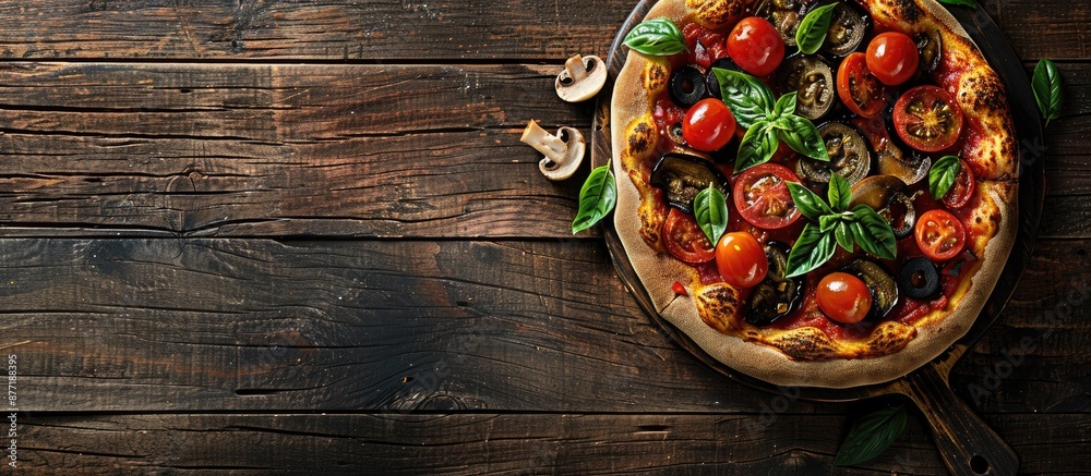 Poster a top down view of a vegetarian pizza featuring eggplant tomato mushrooms and basil on a dark wooden