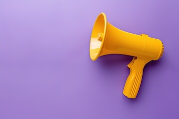 Yellow megaphone on purple background