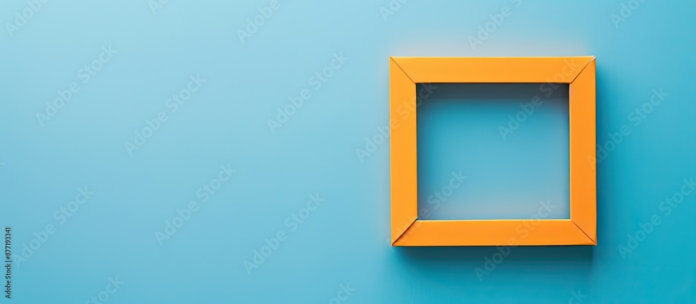 Fototapete Minimal concept trendy greeting card with an empty orange frame on a classic blue background providing copy space image in flat lay style from a top view