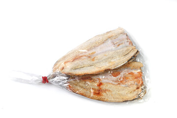salted fish in plastic on a white background