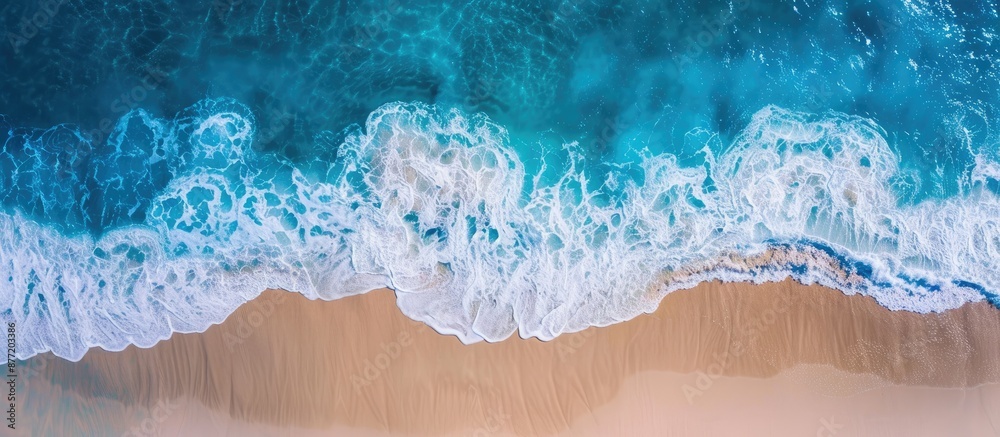 Poster Soothing view of a blue ocean wave and sandy beach with copy space image