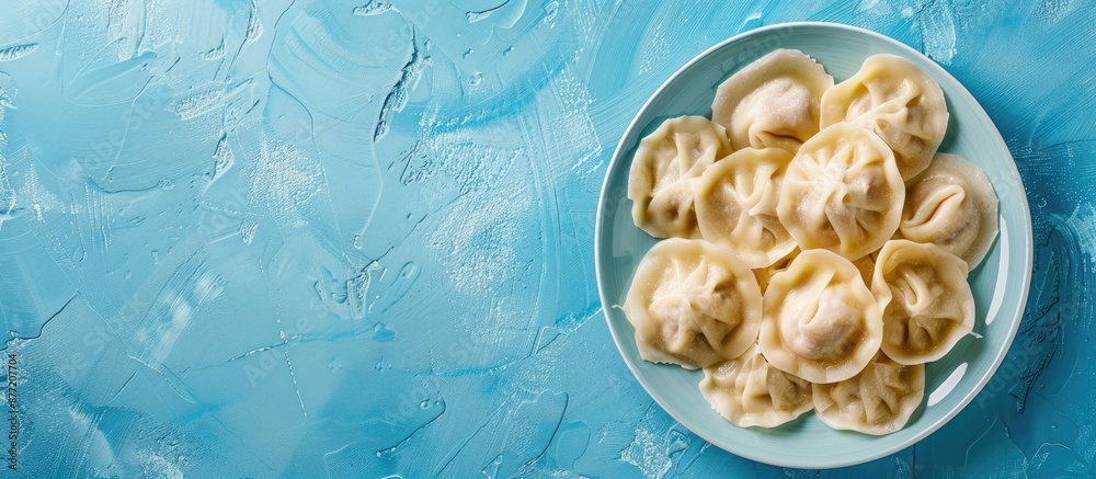 Aufkleber Top view of traditional Russian dumplings and ravioli on a blue background with copy space image available