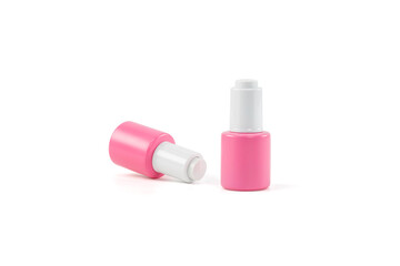 A mock-up- of skin serum bottles isolated on white background with clipping path.  Pink serum bottles. Skin care product.