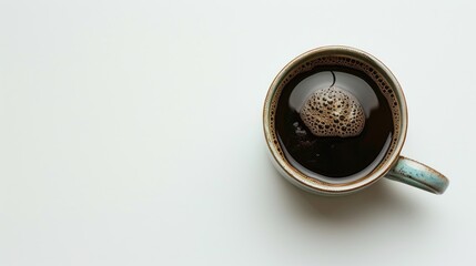 Coffee cup with black coffee on white background Top view with copy space cafe concept Freshly brewed coffee in a cup