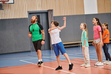 group of young people energetically stand atop a basketball court, showcasing their enthusiasm for the sport.