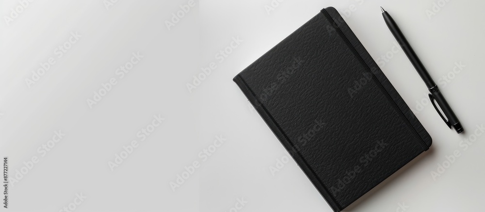 Aufkleber Isolated black notebook from a top down perspective with an empty area for adding images or text also known as a copy space image