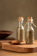 Mix of green seasonings in a small glass bottle.