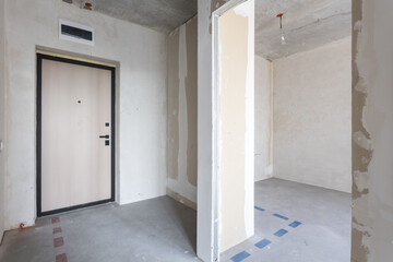 interior of the apartment without decoration in gray colors. rough finish