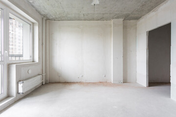 interior of the apartment without decoration in gray colors. rough finish