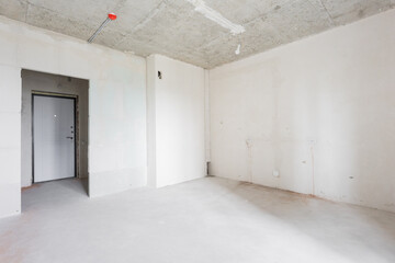 interior of the apartment without decoration in gray colors. rough finish