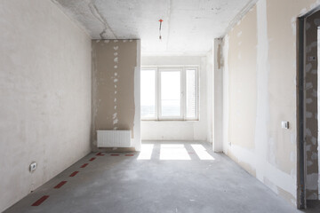 interior of the apartment without decoration in gray colors. rough finish