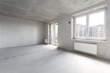 interior of the apartment without decoration in gray colors. rough finish