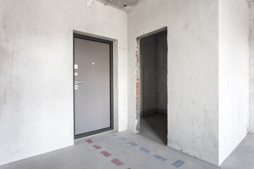 interior of the apartment without decoration in gray colors. rough finish