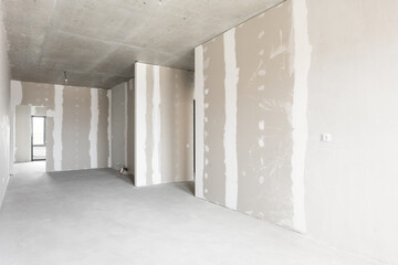 interior of the apartment without decoration in gray colors. rough finish