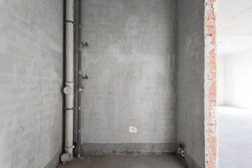 interior of the apartment without decoration in gray colors. rough finish