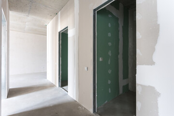 interior of the apartment without decoration in gray colors. rough finish