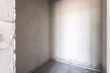 interior of the apartment without decoration in gray colors. rough finish
