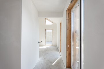 interior of the apartment without decoration in gray colors. rough finish