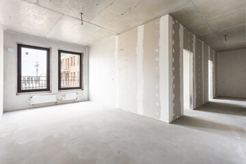 interior of the apartment without decoration in gray colors. rough finish