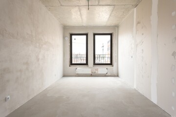 interior of the apartment without decoration in gray colors. rough finish