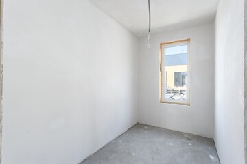 interior of the apartment without decoration in gray colors. rough finish