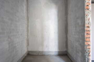 interior of the apartment without decoration in gray colors. rough finish