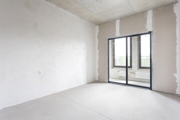 interior of the apartment without decoration in gray colors. rough finish