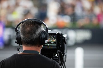 cameraman silhouette filming during event