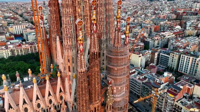 Basilica Sagrada Familia at sunrise in Barcelona, aerial close up view of Sagrada familia cathedral in Barcelona, Spain, famous landmark in Barcelona by Antonio Gaudi